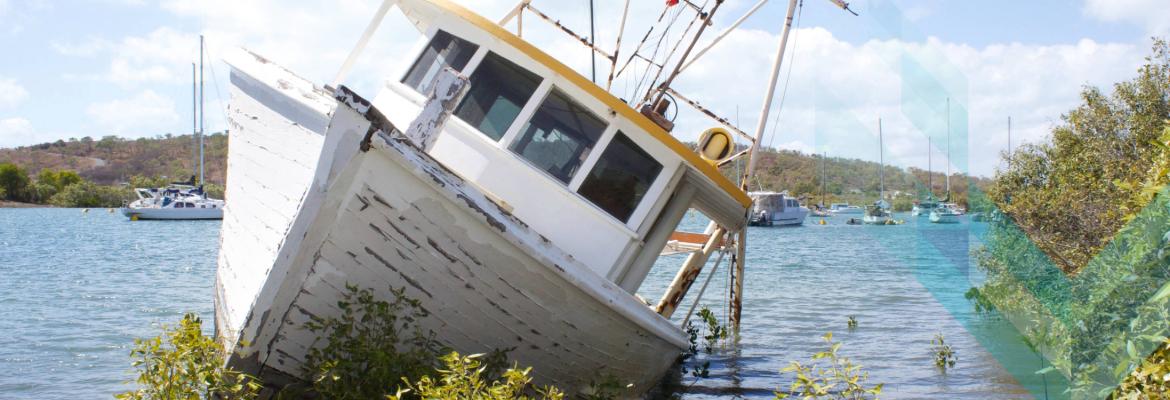 a vessel listing badly next to shore