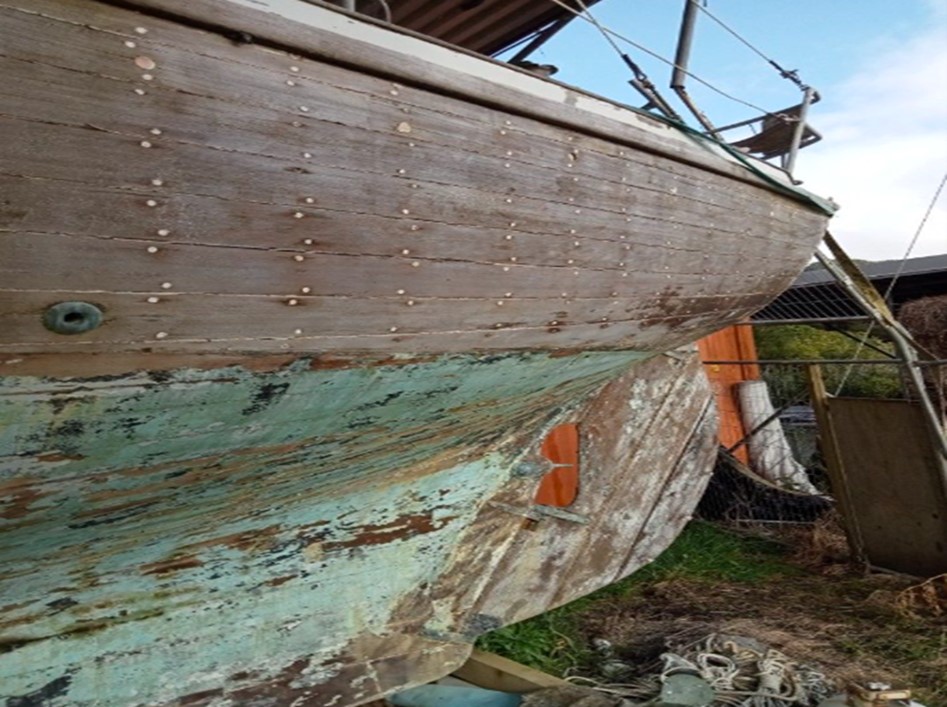 The back of a vessel lifted out of the water for a better inspection