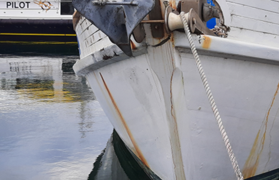 A boat with rust streaks which are often indicators of the type / material of fasteners and that corrosion or deterioration might require further inspection.