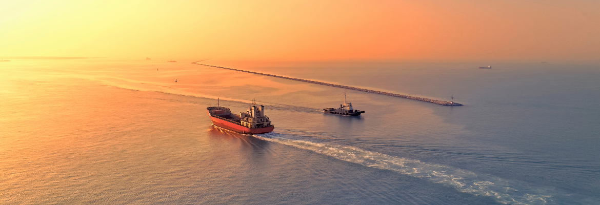 Ships sailing into sunset